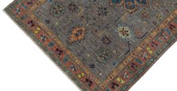 Backside of handmade New Kazak rug showing knot structure and weave density