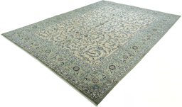 Corner detail of 2000s Kashan rug showing border pattern and Cork pile