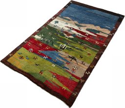 Corner detail of 2000s Persian Gabbeh rug showing border pattern and Wool pile