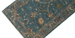 Backside of handmade New Farahan rug showing knot structure and weave density