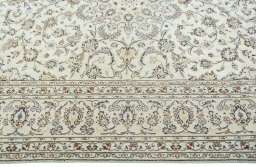 Corner detail of 2000s Kashan rug showing border pattern and Wool pile