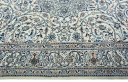 Corner detail of 2000s Kashmar rug showing border pattern and Wool pile