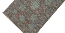Backside of handmade New Farahan rug showing knot structure and weave density