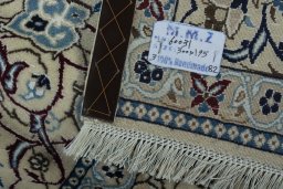 Backside of handmade 2000s Nain rug showing knot structure and weave density