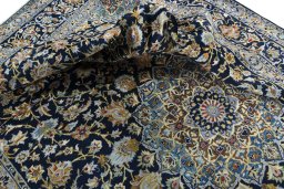 Surface texture of 2000s Kashan rug with natural Wool and intricate pattern
