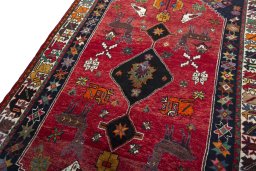 Backside of handmade 2000s Shiraz rug showing knot structure and weave density