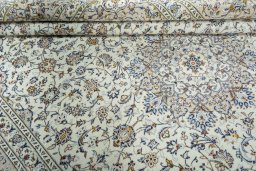 Close-up detail of 2000s Kashan rug from Iran / Persia showing Wool weave