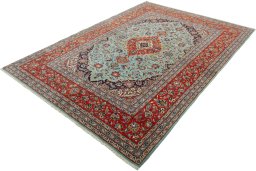 Corner detail of New Kashan rug showing border pattern and Cork pile