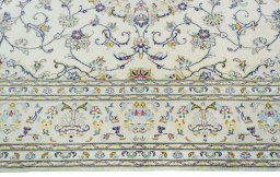 Corner detail of New Kashan rug showing border pattern and Wool pile