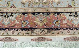 Backside of handmade New Tabriz 50/60/70 Raj rug showing knot structure and weave density