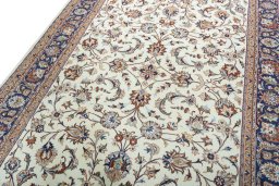 Backside of handmade 2000s Mashad rug showing knot structure and weave density