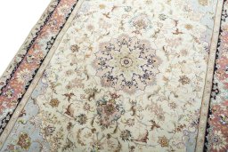 Backside of handmade New Tabriz 50/60/70 Raj rug showing knot structure and weave density