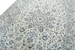 Backside of handmade 2000s Kashan rug showing knot structure and weave density