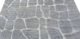 Backside of handmade New Morocco rug showing knot structure and weave density