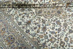 Close-up detail of 2000s Kashan rug from Iran / Persia showing Wool weave