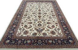 Surface texture of 2000s Mashad rug with natural Wool and intricate pattern