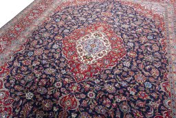 Backside of handmade New Kashan rug showing knot structure and weave density