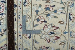 Backside of handmade 2000s Nain rug showing knot structure and weave density