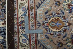Backside of handmade New Kashmar rug showing knot structure and weave density