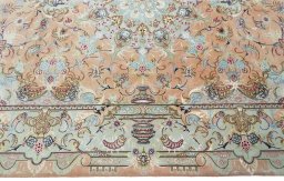 Corner detail of 2000s Tabriz 50/60/70 Raj rug showing border pattern and Cork pile