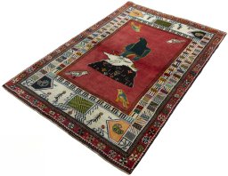 Corner detail of 2000s Persian Gabbeh rug showing border pattern and Wool pile