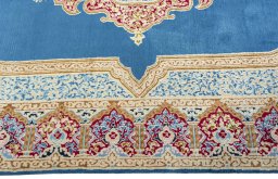 Corner detail of 1970s Kerman rug showing border pattern and Wool pile