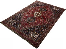 Corner detail of 2000s Shiraz rug showing border pattern and Wool pile