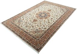Corner detail of 2000s Tabriz 50/60/70 Raj rug showing border pattern and Cork pile
