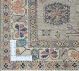 Corner detail of New Kazak rug showing border pattern and Wool pile