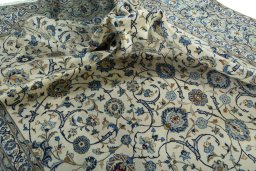 Surface texture of 2000s Kashan rug with natural Wool and intricate pattern