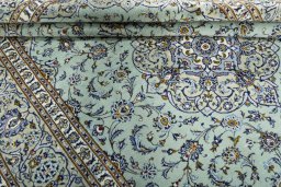 Close-up detail of 2000s Kashan rug from Iran / Persia showing Wool weave