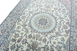 Backside of handmade 2000s Nain rug showing knot structure and weave density