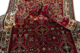 Corner detail of 2000s Shiraz rug showing border pattern and Wool pile