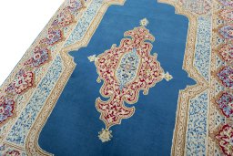 Backside of handmade 2000s Kerman rug showing knot structure and weave density
