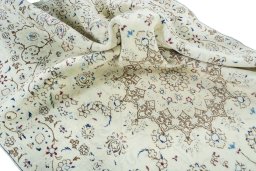 Surface texture of 2000s Nain rug with natural Wool and intricate pattern