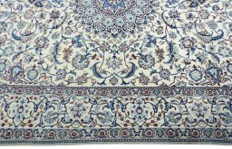 Corner detail of 2000s Nain rug showing border pattern and Wool pile