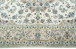 Corner detail of New Kashan rug showing border pattern and Wool pile