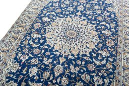 Backside of handmade 2000s Nain rug showing knot structure and weave density