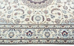 Corner detail of New Nain rug showing border pattern and Wool pile