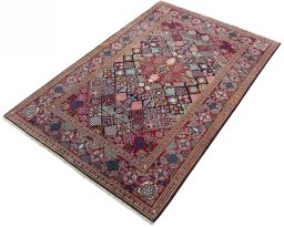 Corner detail of 2000s Kashan rug showing border pattern and Wool pile