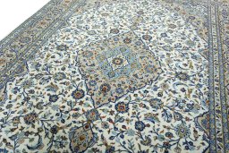 Backside of handmade 2000s Kashan rug showing knot structure and weave density
