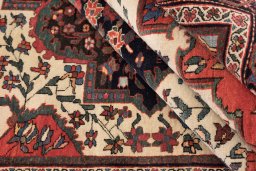 Corner detail of 1900s Farahan rug showing border pattern and Wool pile
