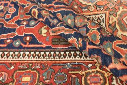 Close-up detail of 1900s Farahan rug from Iran / Persia showing Wool weave