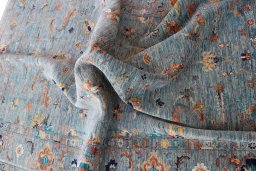 Backside of handmade New Farahan rug showing knot structure and weave density
