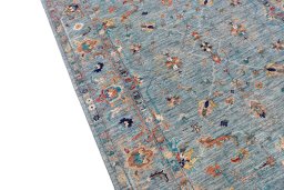 Backside of handmade New Farahan rug showing knot structure and weave density