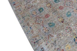 Backside of handmade New Farahan rug showing knot structure and weave density
