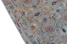 Backside of handmade New Farahan rug showing knot structure and weave density