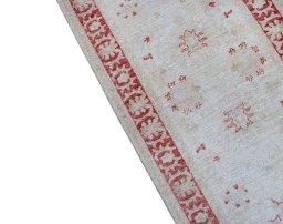Backside of handmade New Farahan rug showing knot structure and weave density