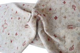 Backside of handmade New Farahan rug showing knot structure and weave density