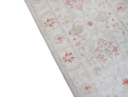 Backside of handmade New Farahan rug showing knot structure and weave density